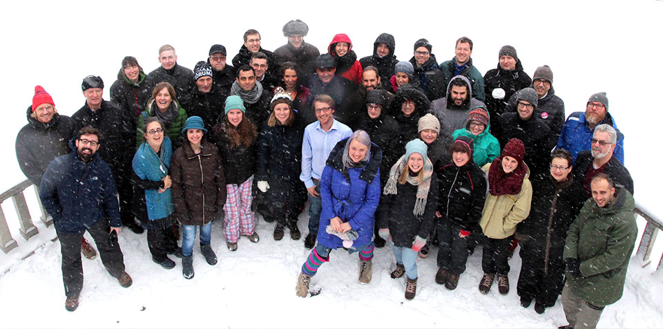 40 BlueHealth researchers gather in the snow for a photo