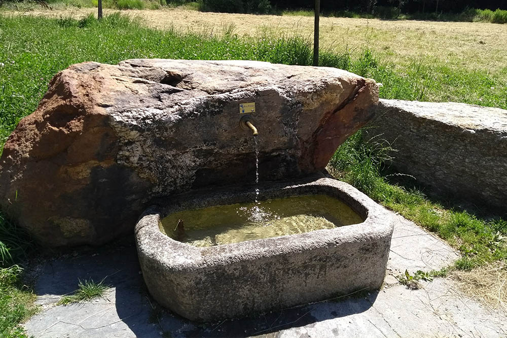 A fountain set into a large stone